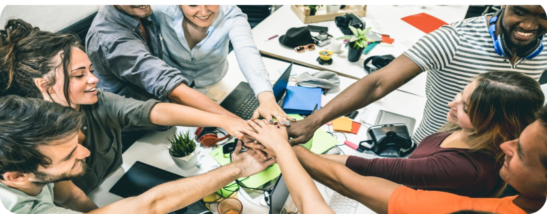 Team hands joined together in the center
